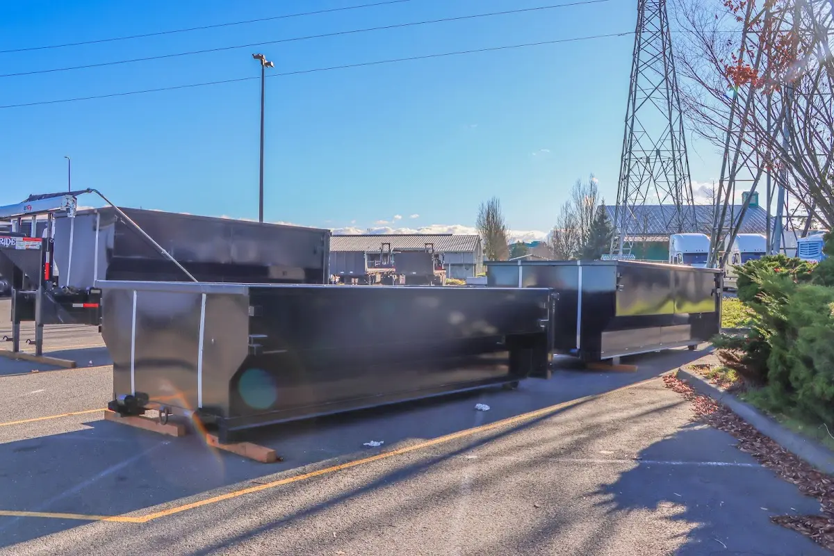 Roll-off dumpster ready for waste disposal at job site for 2 Yard Dumpster Rental in Wake Forest